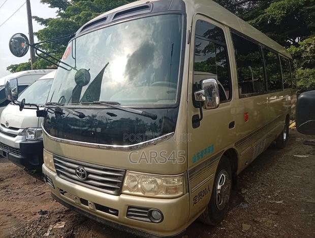 Toyota Coaster 2018 Gold