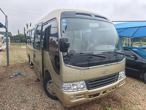 Toyota Coaster 2015 Gold
